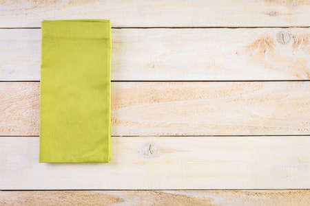 Linen dinner napkins on a wood background.の写真素材