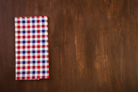 Linen dinner napkins on a wood background.の写真素材