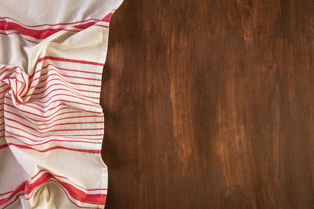Dish towel on a wood background.の写真素材