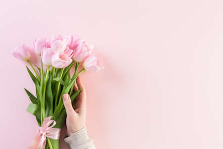 Bouquet of pink tulips wrapped in pink paper.の写真素材