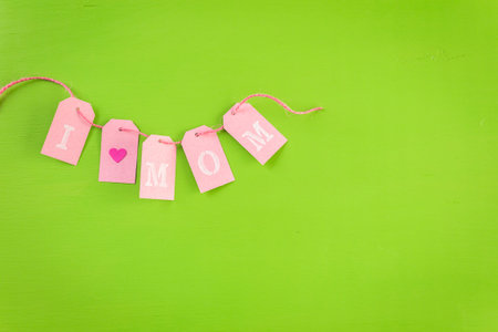 Decorations for Mother's Day on a  wood board.