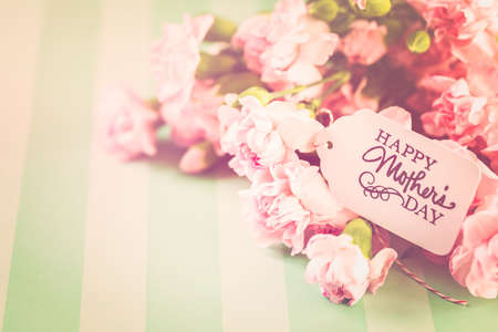 Pink flowers for Mother's Day on stripe paper.の写真素材