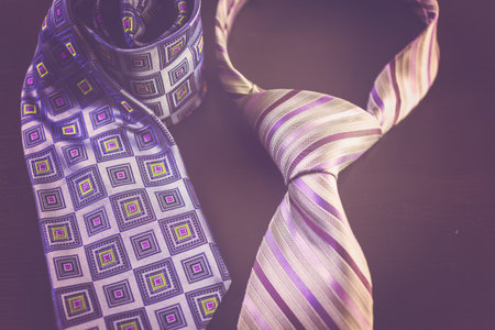 Men's ties on a wood background.の写真素材