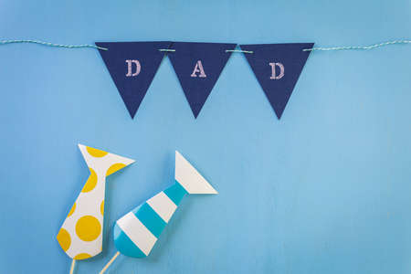 White letters DAD on a painted wood background.の写真素材