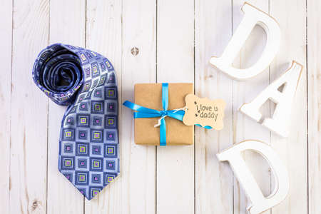 White letters DAD on a wood background.の写真素材