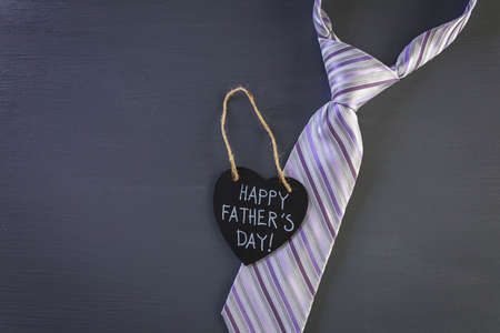 Happy Father's Day sign on a heart shape chalk board.の写真素材