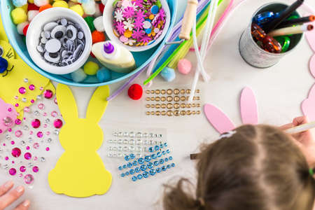 Step by step. Mother and daughter decorating Easter Bunnies.の写真素材