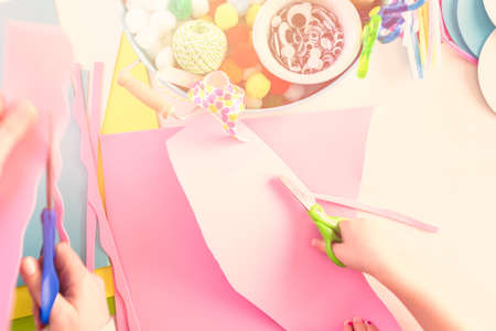 Step by step. Mother and daughter decorating paper Easter eggs.の写真素材