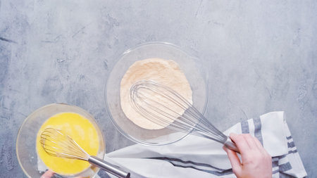 Step by step. Flat lay. Mixing ingredients together in glass mixing bowl for spicy jalapeno...