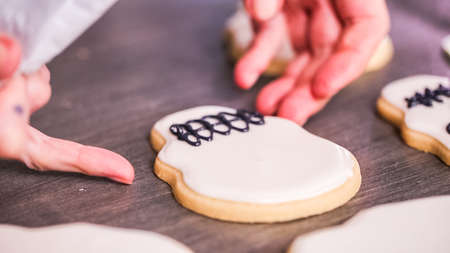 Step by step. Decorating sugar skull cookies with different color royal icing.の写真素材