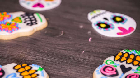 Step by step. Decorating sugar skull cookies with different color royal icing.の写真素材