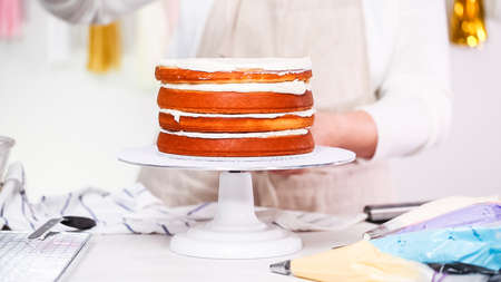 Step by step. Pastry chef making unicorn cake for little girl birthday party.の写真素材