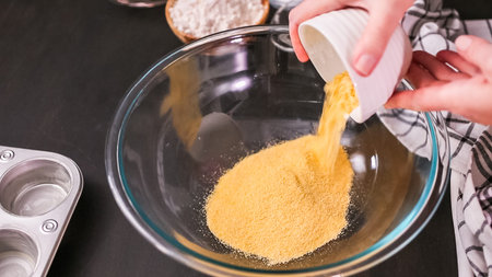 Step by step. Baking cornbread muffins in metal muffin tin.