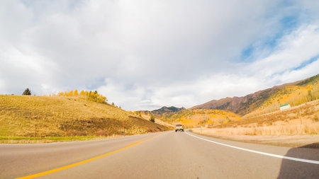 Driving on mountain highway 67 to Cripple Creek from Victor in Autumn.の写真素材