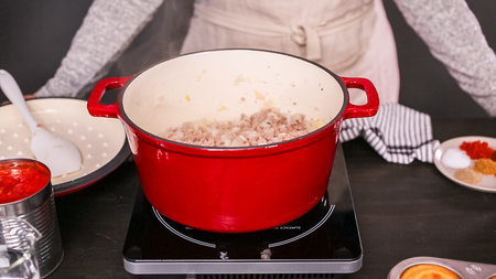 Step by step. Cooking turkey chili in enameled cast iron covered dutch oven.の写真素材