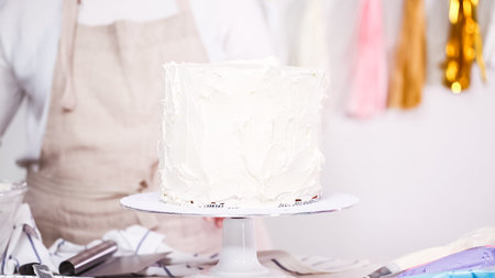 Step by step. Pastry chef making unicorn cake for little girl birthday party.