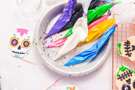 Piping bag with different color of royal icing.の写真素材