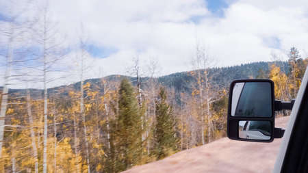 Driving on small mountain dirt roads from Colorado Springs to Cripple Creek in Autumn.の写真素材