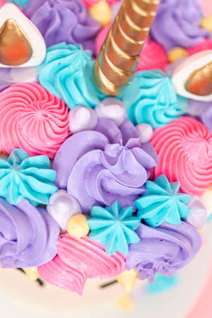 Unicorn cake decorated with multicolor buttercream icing.の写真素材