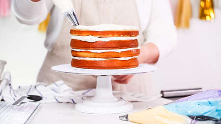 Step by step. Pastry chef making unicorn cake for little girl birthday party.の写真素材
