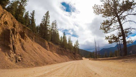 Driving on small mountain dirt roads from Colorado Springs to Cripple Creek in Autumn.の写真素材