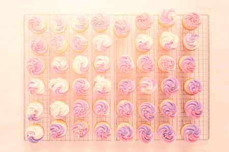 Baking small cupcakes with unicorn theme.