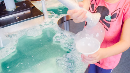 Kids science with bubbles at local science museum.