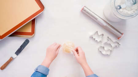Rolling out sugar cookie dough to make unicorn cookies.の写真素材