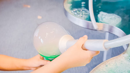 Kids science with bubbles at local science museum.の写真素材