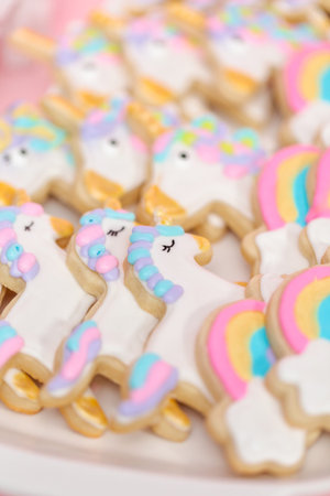 Unicorn sugar cookies decorated with royal icing at the kids birthday party.の写真素材