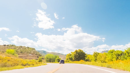 Driving on paved road near Chatfield reservoir South of Denver.の写真素材