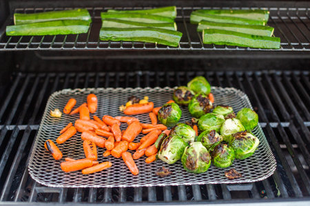 Cooking healthy dinner on outdoor gas grill.