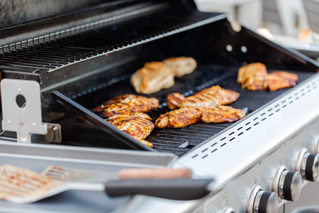 Grilling cod for fish tacos on outdoor gas grill.