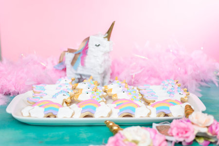 Unicorn sugar cookies decorated with royal icing at the kids birthday party.