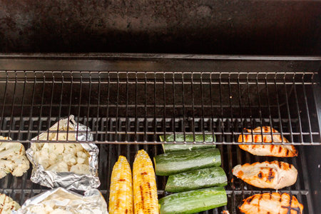 Grilling healthy dinner with organic chicken and vegetables.の写真素材