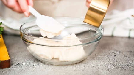 Preparing sauce for Mexican corn on the cob Elote.の写真素材