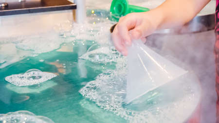 Kids science with bubbles at local science museum.の写真素材