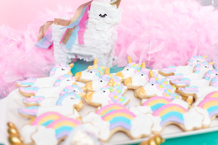 Unicorn sugar cookies decorated with royal icing at the kids birthday party.