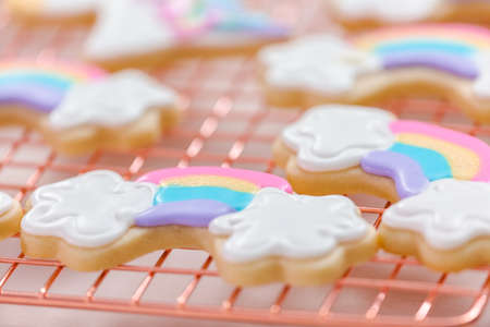 Decorating unicorn themed sugar cookies with royal icing.の写真素材