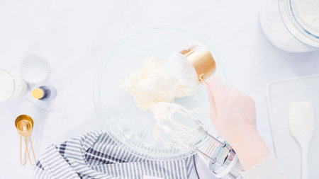 Step by step. Mixing buttercream frosting for vanilla cupcakes.