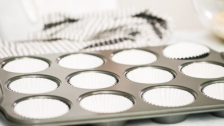 Step by step. Baking vanilla cupcakes in metal cupcake pan.の写真素材