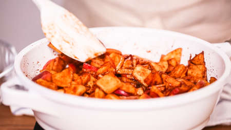 Step by step. Frying red apples with brown sugar for filling to make empanadas.の写真素材
