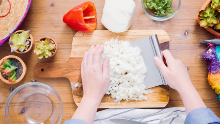 Step by step. Slicing vegetables for filling to make empanadas.