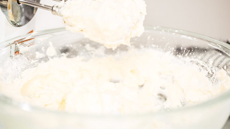 Step by step. Mixing buttercream frosting for vanilla cupcakes.