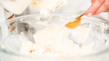 Step by step. Mixing buttercream frosting for vanilla cupcakes.の写真素材