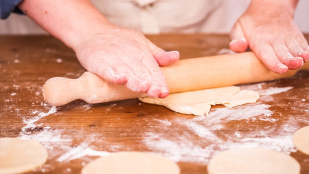 Step by step. Rolling dough for home made empanadas.