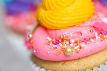 Close up of unicorn cupcakes with multicolor buttercream icing.