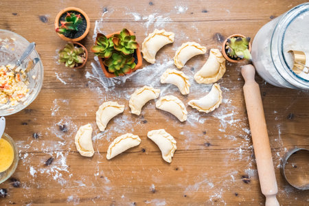 Making homemade chicken empanadas.