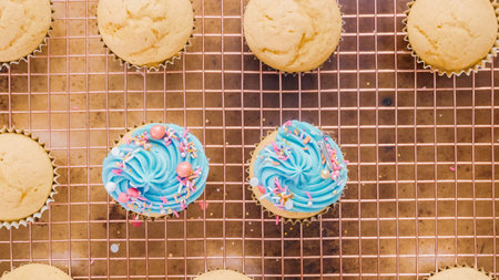 Step by step. Decorating unicorn themed vanilla cupcakes with rainbow buttercream frosting.の写真素材