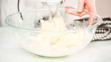 Step by step. Mixing buttercream frosting for vanilla cupcakes.の写真素材